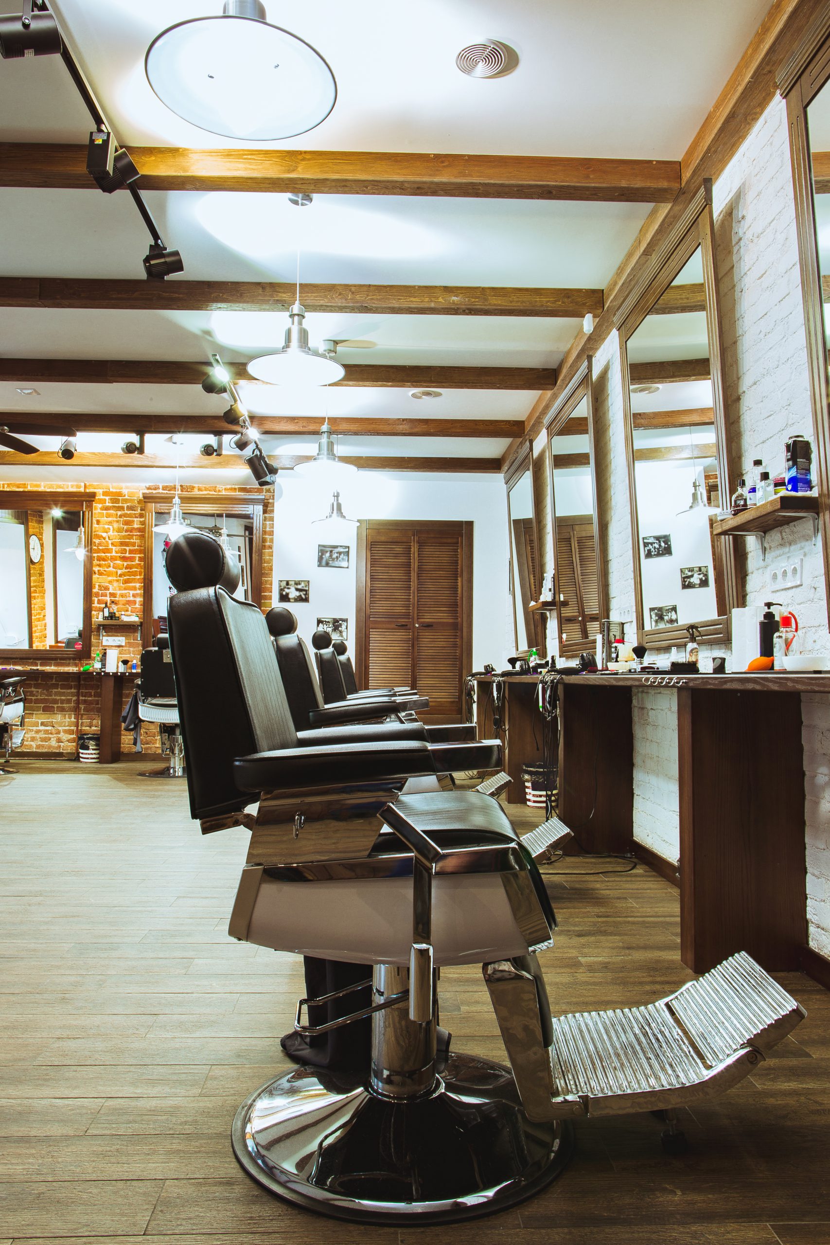 Classic leather barber chairs in the wood-panelled Level Two Barbershop