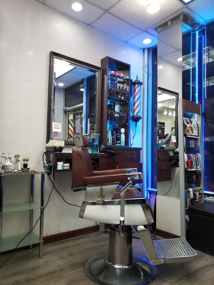 Mirrors, barber pole and styling station inside Level Two Barbershop